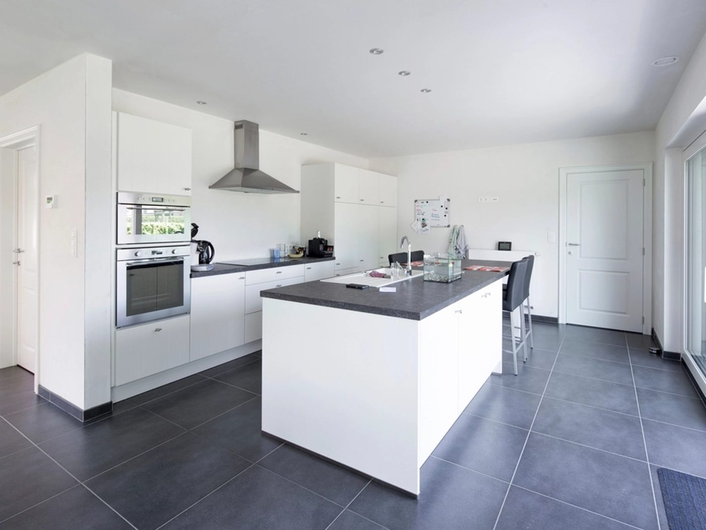 Custom white kitchen cabinetry with island in a Chicagoland home