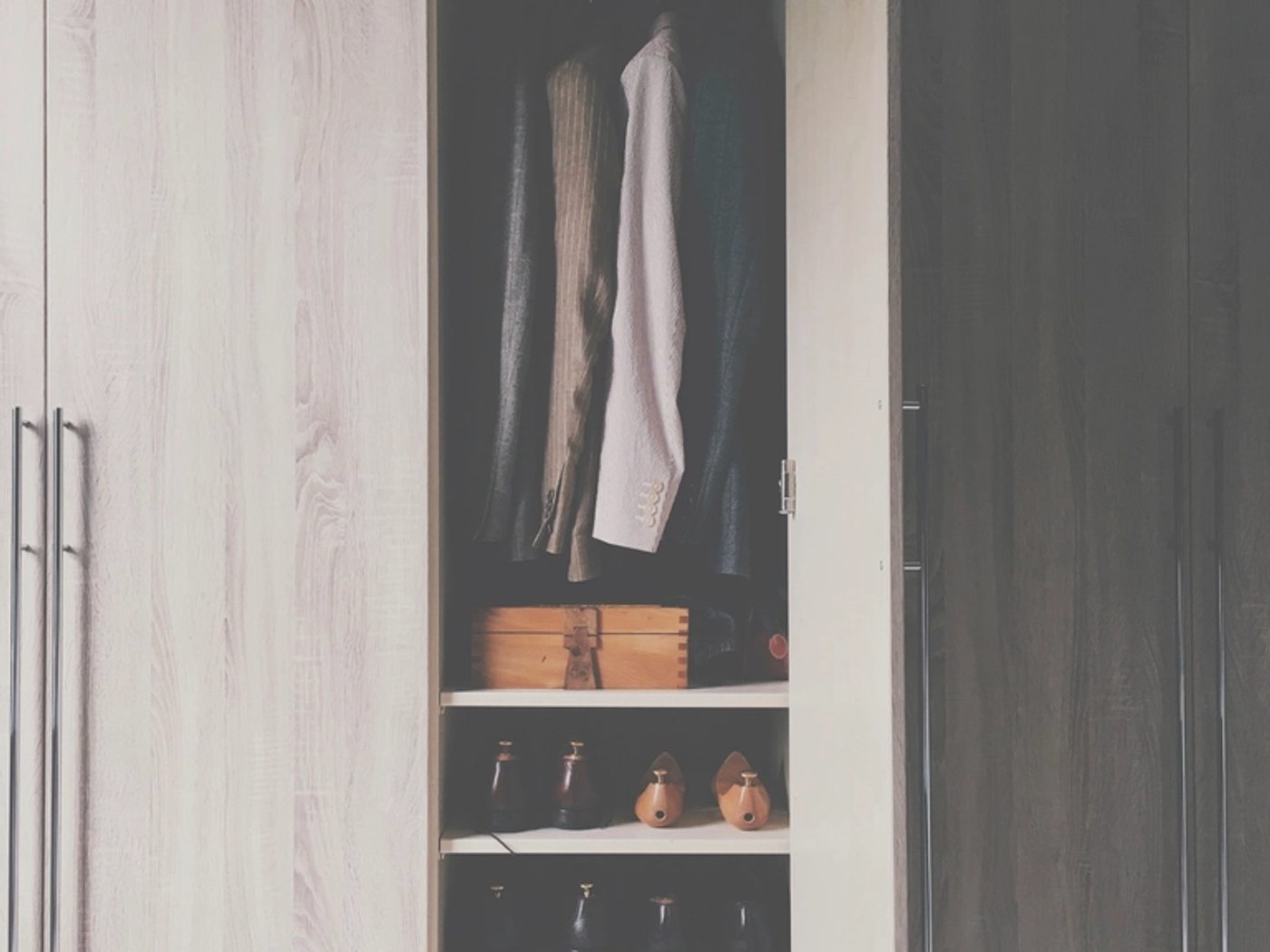 Custom built-in closet with hanging space and shelving in a Chicagoland home